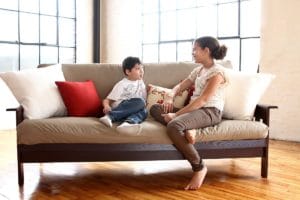 Kids Sitting on a Futon Sofa Bed
