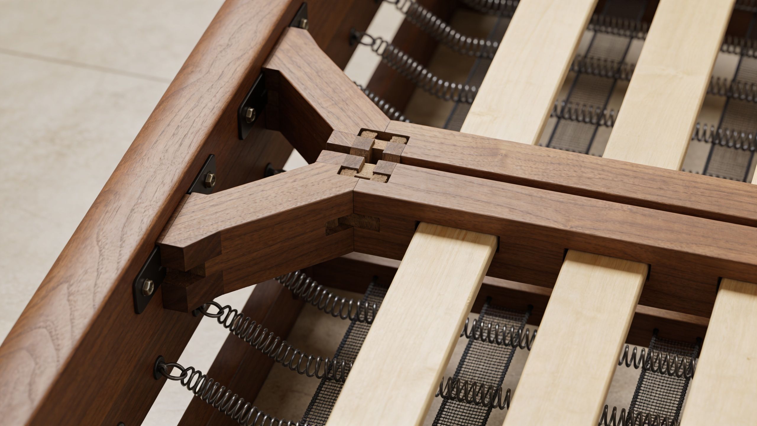 A close up view of a modern wooden sofa frame showing intricate joinery and internal metal spring support.