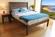 The Esmont Natural Platform Bed w/Headboard by Savvy Rest