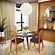 Holbeck Wicker Dining Chair with Upholstered Leather Seat, Black by LeisureMod