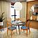 Holbeck Wicker Dining Chair with Upholstered Leather Seat, Navy Blue by LeisureMod